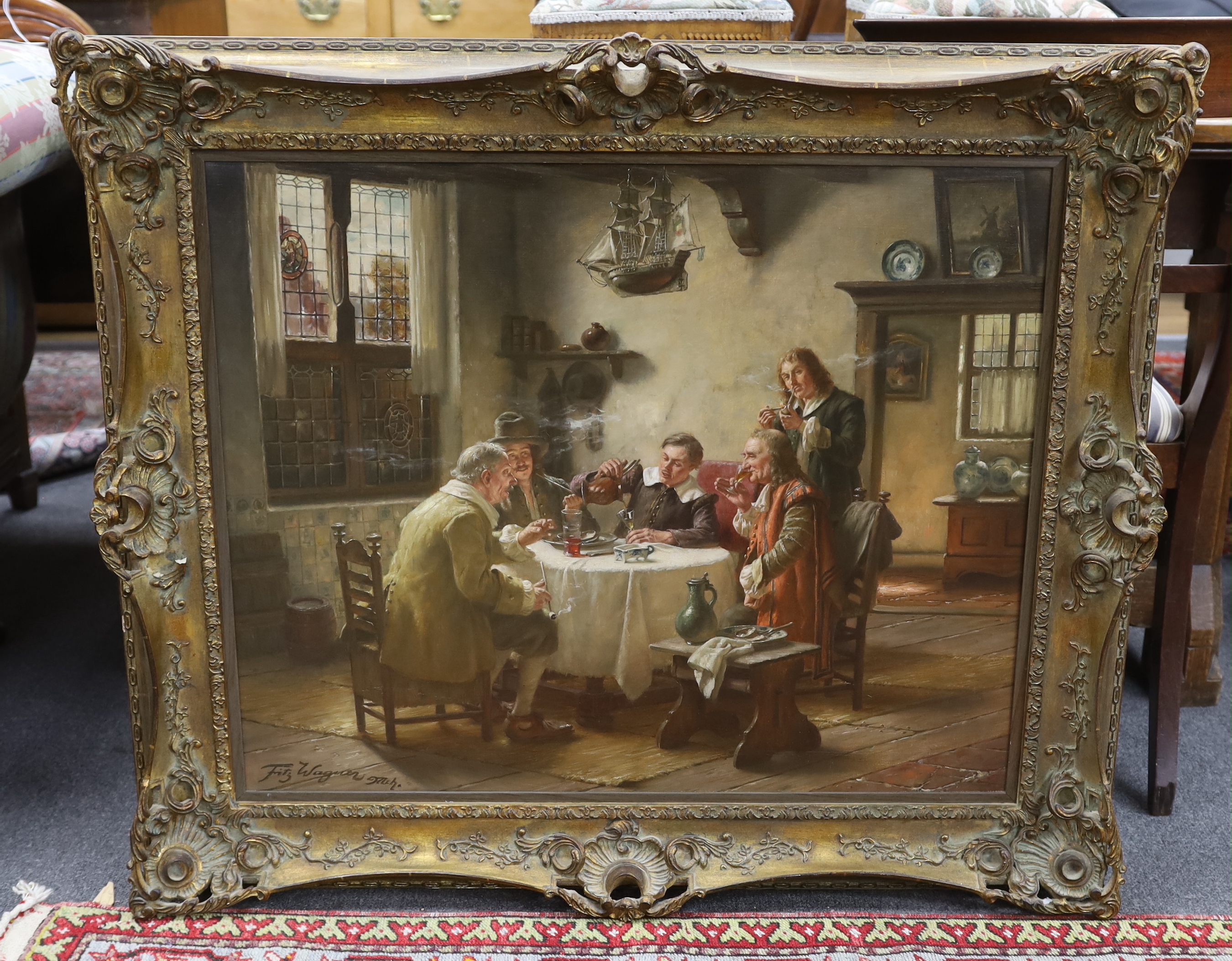 Fritz Wagner (German 1872-1967)' oil on canvas, Figures seated at a table wearing 17th century dress, signed, ornate gilt framed, 78cm x 63cm